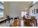 Open-concept living and dining area with high ceilings and large windows at 10952 Porto Foxi St, Las Vegas, NV 89141