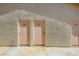 Exterior shot of peach colored building doors at 1104 Pinto Rock Ln # 101, Las Vegas, NV 89128