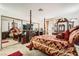 Spacious main bedroom with traditional furniture, a large mirror, and a cozy atmosphere at 1104 Pinto Rock Ln # 101, Las Vegas, NV 89128