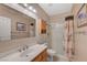 Well-lit bathroom featuring a vanity, mirror, and a shower with a stylish curtain at 1316 Borderwood Ln, North Las Vegas, NV 89031