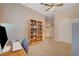 Bright bedroom with a bookcase, neutral carpeting and a closet with sliding doors at 1316 Borderwood Ln, North Las Vegas, NV 89031
