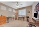 Comfortable spare bedroom featuring bright natural light, ceiling fan, and neutral carpeting at 1316 Borderwood Ln, North Las Vegas, NV 89031