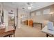 Bedroom with a ceiling fan, carpeted floor, and work desks at 1316 Borderwood Ln, North Las Vegas, NV 89031