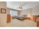Serene bedroom showcasing a ceiling fan and neutral tones to make it a relaxing space at 1316 Borderwood Ln, North Las Vegas, NV 89031