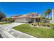 Beautiful home with a well-manicured lawn and a large driveway at 1316 Borderwood Ln, North Las Vegas, NV 89031