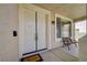 Inviting double front door with a 'Welcome' mat and outdoor seating at 1316 Borderwood Ln, North Las Vegas, NV 89031