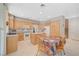 Bright kitchen with light wood cabinets, tile floors, and a center island at 1316 Borderwood Ln, North Las Vegas, NV 89031