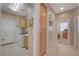 Functional laundry room with modern washer/dryer, storage cabinets, and access to other rooms at 1316 Borderwood Ln, North Las Vegas, NV 89031