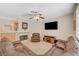 Spacious living room features a fireplace, entertainment center, and comfortable leather seating at 1316 Borderwood Ln, North Las Vegas, NV 89031