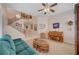 Cozy living room with carpeted floors, high ceilings, and a stairway to second floor at 1316 Borderwood Ln, North Las Vegas, NV 89031