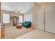 Living room with carpeted floors, lots of windows and a ceiling fan at 1316 Borderwood Ln, North Las Vegas, NV 89031