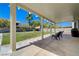 Spacious covered patio provides ample space for outdoor living overlooking large backyard at 1316 Borderwood Ln, North Las Vegas, NV 89031