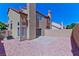 Charming backyard with concrete patio, rock landscaping, and privacy wall, perfect for entertaining at 1663 Cloister Ave, Henderson, NV 89014
