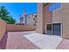 Private backyard featuring a concrete patio and rock landscaping, perfect for outdoor relaxation at 1663 Cloister Ave, Henderson, NV 89014