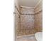 Walk-in shower features decorative tile and updated fixtures at 1663 Cloister Ave, Henderson, NV 89014