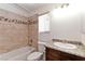 Bathroom features granite countertop, wooden cabinets, tiled shower and a window at 1663 Cloister Ave, Henderson, NV 89014