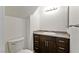 Powder room featuring granite countertop and dark wood vanity at 1663 Cloister Ave, Henderson, NV 89014