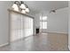 Bright living room with fireplace, tile flooring, and contemporary chandelier lighting at 1663 Cloister Ave, Henderson, NV 89014