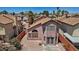 Aerial view of a home with a unique patterned patio, surrounded by greenery and privacy walls at 1711 Ember Glow Cir, Las Vegas, NV 89119