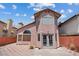Charming backyard patio with a patterned layout and unique architectural details at 1711 Ember Glow Cir, Las Vegas, NV 89119
