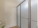 Bathroom stall features a frosted glass sliding door and tiled flooring at 1711 Ember Glow Cir, Las Vegas, NV 89119