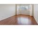Unfurnished bedroom space with hardwood floors and bright natural lighting at 1711 Ember Glow Cir, Las Vegas, NV 89119