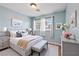 Stylishly staged bedroom with a queen-size bed, soft lighting, and neutral decor at 1711 Ember Glow Cir, Las Vegas, NV 89119