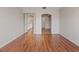 Spacious hallway featuring hardwood floors, neutral paint, and ample lighting at 1711 Ember Glow Cir, Las Vegas, NV 89119