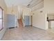 A spacious living area that includes staircase, and tile flooring at 1711 Ember Glow Cir, Las Vegas, NV 89119