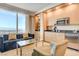 A modern kitchenette complete with essential appliances and a comfortable seating area overlooking the city at 2000 N Fashion Show Dr # 4015, Las Vegas, NV 89109