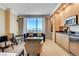 Inviting living room with stunning city views, kitchenette, and comfortable seating at 2000 N Fashion Show Dr # 4015, Las Vegas, NV 89109