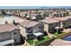 Overhead shot of residential properties, showing backyard with faux grass and patio, in a Gathering-friendly community at 2024 Mystic Wave Rd, North Las Vegas, NV 89031
