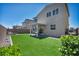 Lush backyard with artificial turf and a covered patio at 2024 Mystic Wave Rd, North Las Vegas, NV 89031