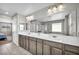 Spacious bathroom featuring double sinks, a large mirror, and ample counter space at 2024 Mystic Wave Rd, North Las Vegas, NV 89031