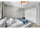 Comfortable bedroom featuring a bed with white linens and modern lighting at 2024 Mystic Wave Rd, North Las Vegas, NV 89031