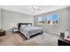 Bright bedroom with modern lighting, neutral walls, and comfortable bedding at 2024 Mystic Wave Rd, North Las Vegas, NV 89031