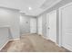 Hallway with plush carpet, light gray walls, two white doors, and white trim at 2024 Mystic Wave Rd, North Las Vegas, NV 89031