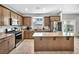 Well-equipped kitchen featuring granite countertops, stainless steel appliances, and ample counter space at 2024 Mystic Wave Rd, North Las Vegas, NV 89031