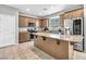 Modern kitchen with granite countertops, stainless steel appliances, and a center island perfect for cooking at 2024 Mystic Wave Rd, North Las Vegas, NV 89031