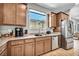 Spacious kitchen features sleek appliances, granite countertops, and ample cabinetry, perfect for culinary enthusiasts at 2024 Mystic Wave Rd, North Las Vegas, NV 89031