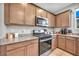 Updated kitchen featuring modern appliances and granite countertops, offering both style and functionality for cooking at 2024 Mystic Wave Rd, North Las Vegas, NV 89031