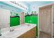 Cheerful ' bathroom with double sinks, and whimsical wall decor at 2229 Armacost Dr, Henderson, NV 89074