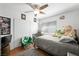 Cozy bedroom featuring a ceiling fan, light walls, and natural light at 2229 Armacost Dr, Henderson, NV 89074