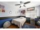 Comfortable bedroom with ceiling fan, laminate floors, and custom paint at 2229 Armacost Dr, Henderson, NV 89074