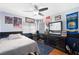 Comfortable bedroom with ceiling fan, laminate floors, and custom paint at 2229 Armacost Dr, Henderson, NV 89074