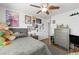 Comfortable bedroom with ceiling fan, light walls, and natural light at 2229 Armacost Dr, Henderson, NV 89074