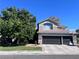 Charming two-story home with a three car garage, landscaped yard, and stone accents at 2229 Armacost Dr, Henderson, NV 89074