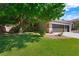 Charming single-Gathering home with well-manicured lawn, mature trees, and a three-car garage at 2229 Armacost Dr, Henderson, NV 89074