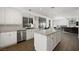 Bright kitchen with a large island, stainless steel appliances, and an open layout connecting to the living area at 2229 Armacost Dr, Henderson, NV 89074