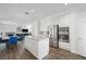 Open-concept kitchen with an island, stainless steel appliances, and a seamless transition to the dining area at 2229 Armacost Dr, Henderson, NV 89074